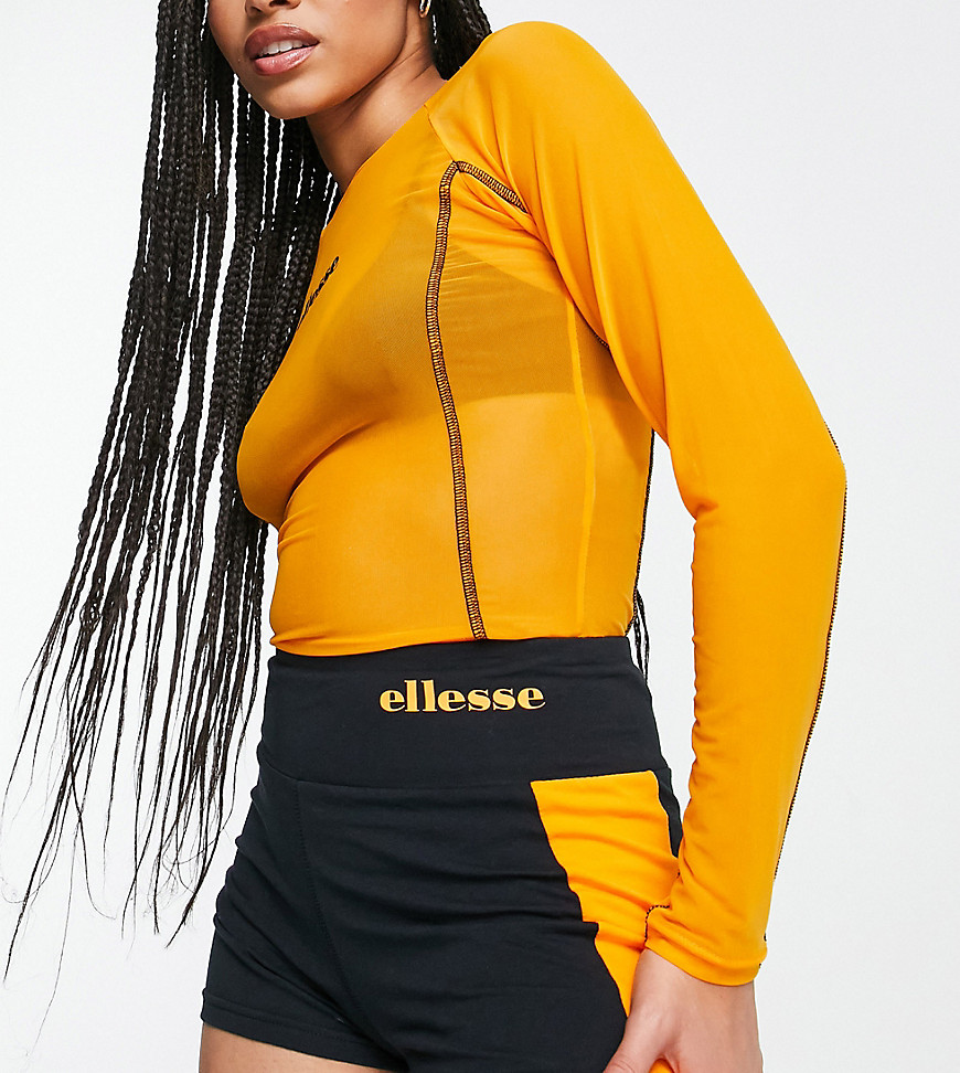 ellesse booty shorts with orange pannelling in black