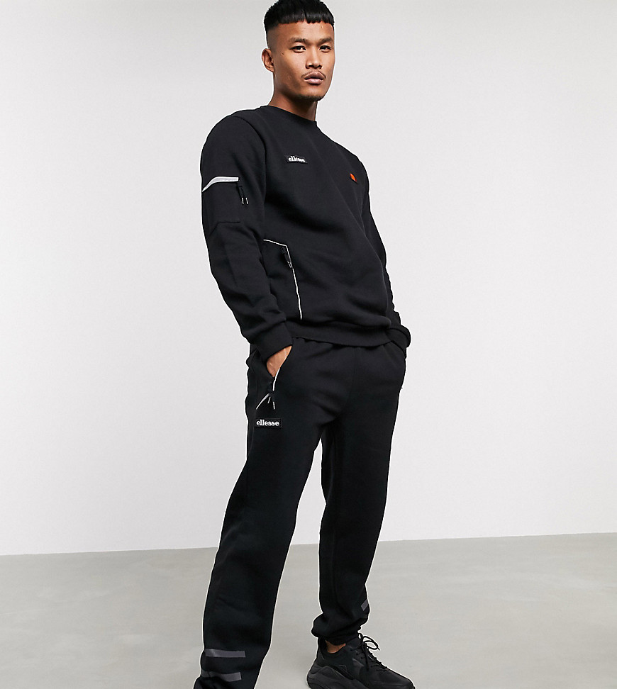 Ellesse Carl sweatpant with reflective stripes in black exclusive at ASOS
