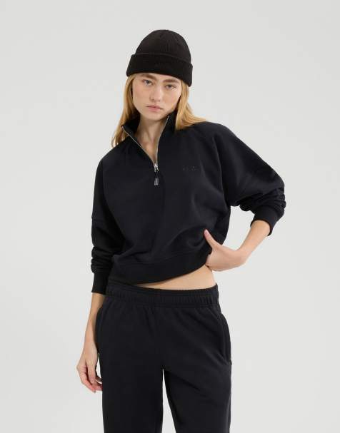 ellesse Carrera 1/4 zip sweatshirt in black