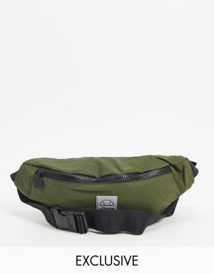 Ellesse cross body bag in high shine khaki exclusive to ASOS-Green