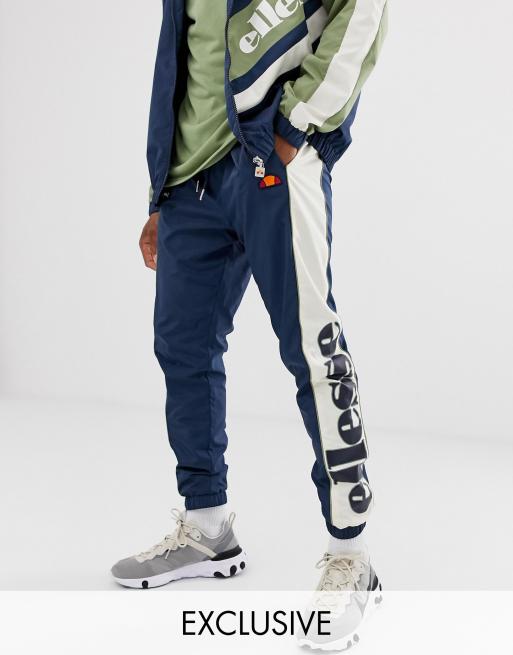 ellesse – Granatowy dres z panelami pochodzący z recyclingu, 3 z 3