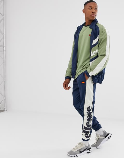 ellesse Gioele woven track pants in navy green exclusive at ASOS