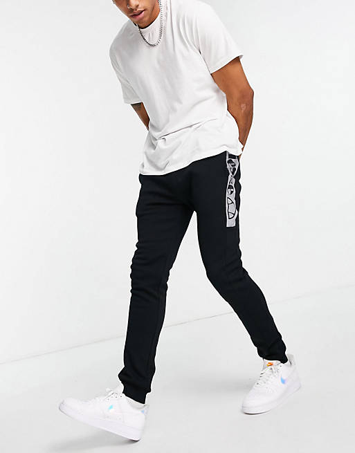 ellesse joggers with reflective branding in black