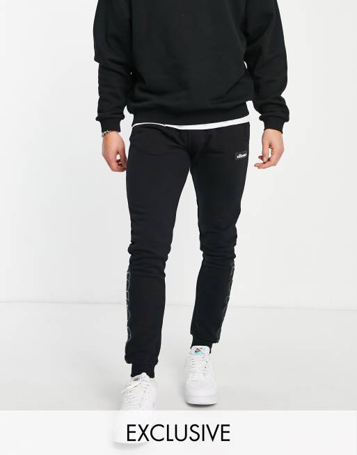 ellesse – Jogginghose in Schwarz mit Zierbändern, exklusiv bei ASOS