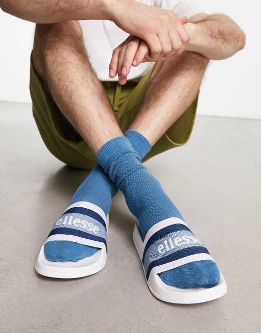 ellesse – LS50 – Slider in Weiß mit gestreiftem Riemen