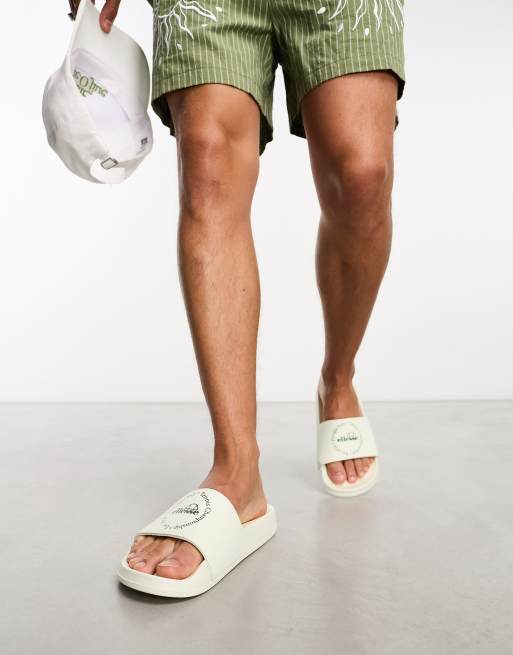 ellesse – LS57 – Slider in Weiß und Grün | ASOS