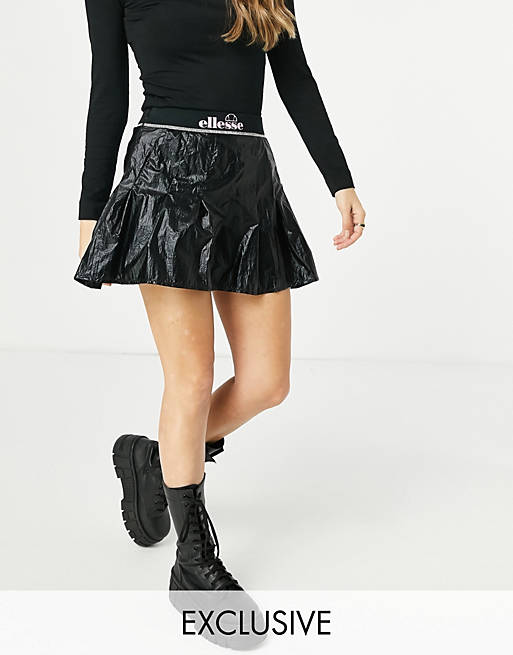 Ellesse metallic pleated skirt with logo banding in black - exclusive to ASOS
