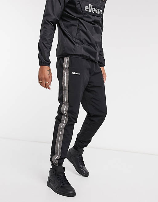 ellesse nylon sweatpants with reflective piping in black | ASOS
