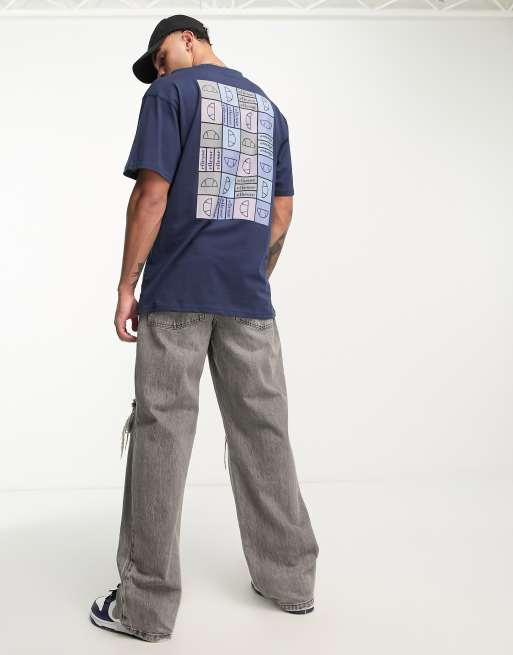 ellesse - Rolletto - T-shirt blu navy con stampa a fiori sul retro 