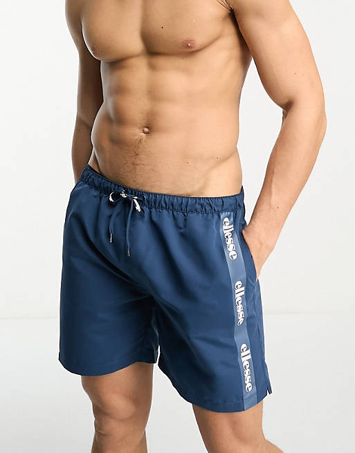 ellesse Scorfano swim shorts with side taping in dark blue | ASOS