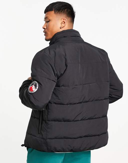 ellesse – Steppjacke in Schwarz mit Markenlogo ASOS