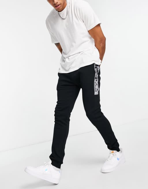 ellesse sweatpants with reflective branding in black