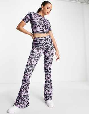 ellesse swirl print flares in purple - ASOS Price Checker