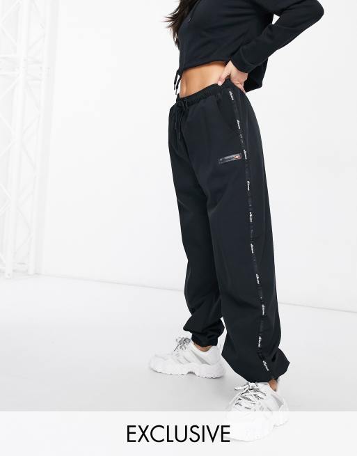 ellesse taping joggers in black - exclusive to ASOS