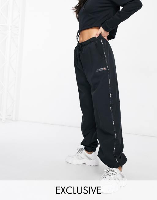 ellesse taping trackies in black - exclusive to ASOS