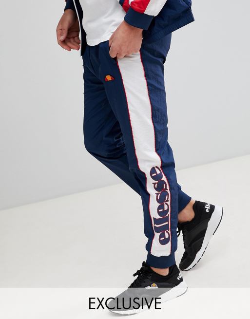 Ellesse navy panel shell track pants sale