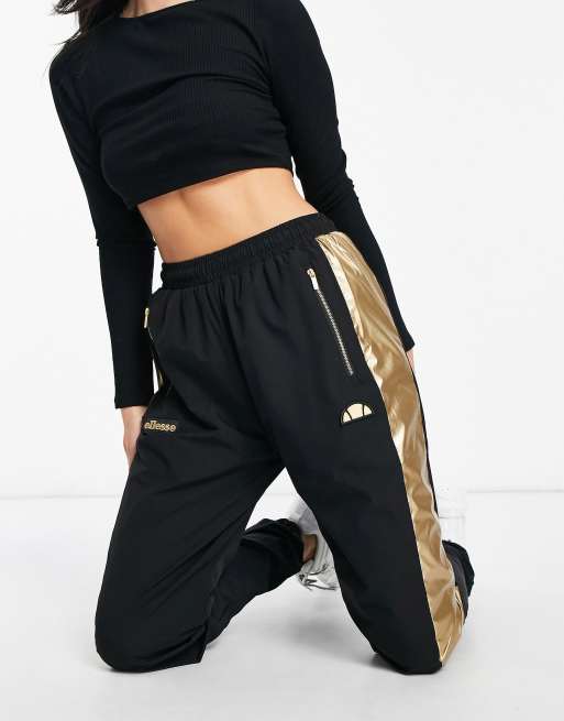 ellesse track pants in black and gold exclusive to ASOS