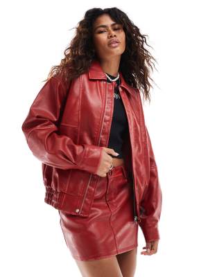 oversized faux leather bomber jacket in distressed red