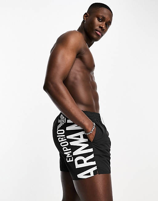 Emporio Armani Bodywear vertical logo swim shorts in black |