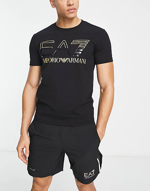 Emporio Armani EA7 gold oversized logo t-shirt in black | ASOS