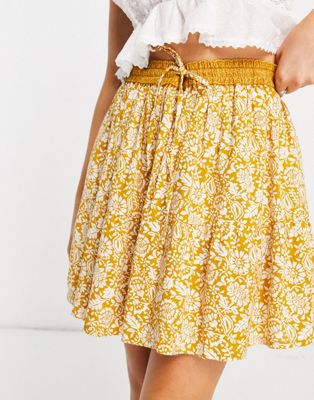 En Crème mini pleated skirt in yellow paisley with tie waist co-ord