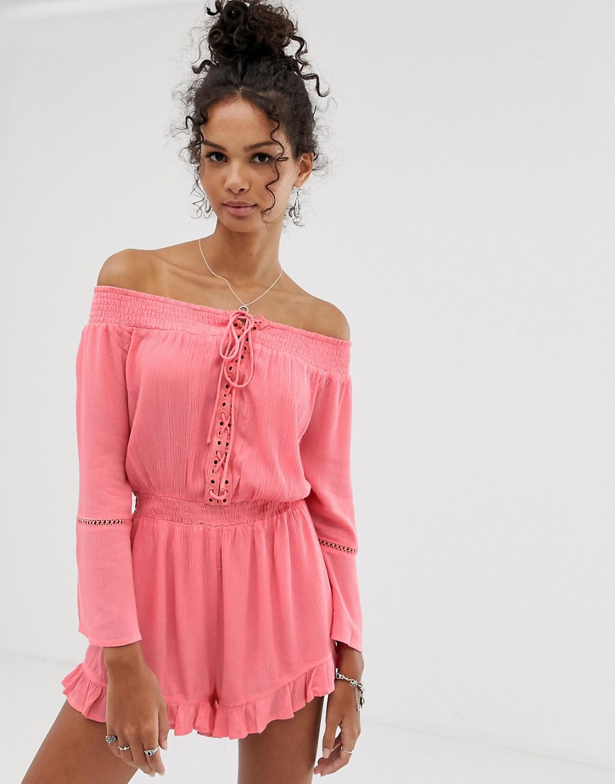 En Crème playsuit with ruffle and lace up detail-Pink