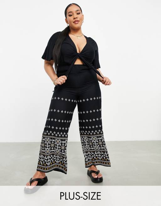 En Crème Plus wide leg jumpsuit with tie front and paisley detail