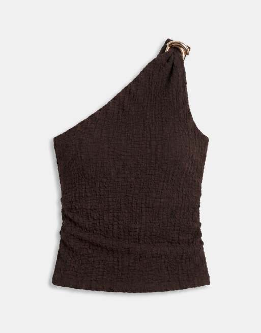 endast asymmetrisk topp i krinklad struktur i mörkbrunt set, 5 av 7