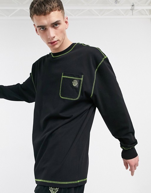 Entente long sleeve top in black with neon overlock stitching