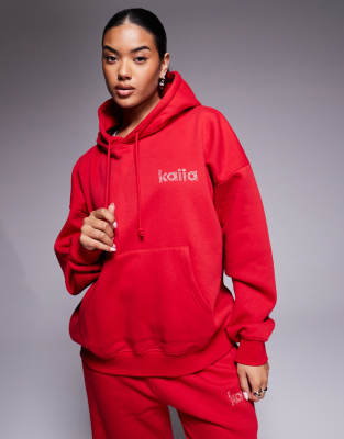 Esclusiva Kaiia - Felpa con cappuccio oversize in misto cotone rossa con logo in strass in coordinato