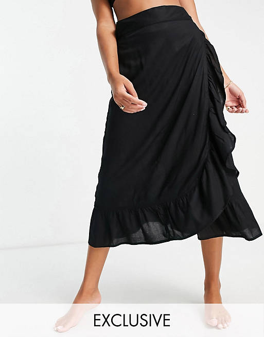 Women Esmee Exclusive frill beach wrap skirt in black 