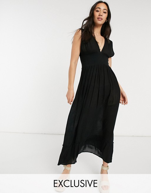 Esmee Exclusive plunge front beach dress with shirred panelling in black