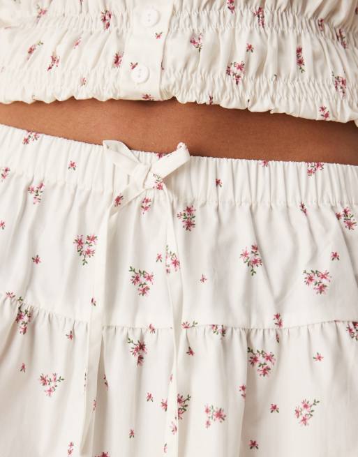 Esmee Exclusive tie front mini beach skirt with trim detail in white and pink ditsy print, 4 of 5