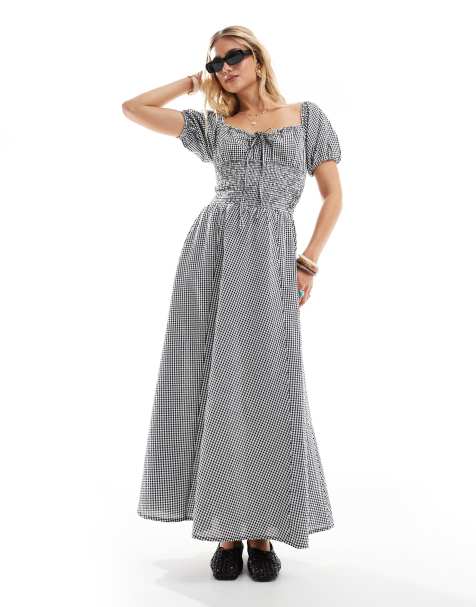 Esmée - Exclusives - Maxi-strandjurk met pofmouwen, strik voor en gingham-ruitje in zwart met wit - view 1