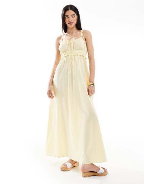 Esmee - Exclusives - Maxi strandjurk met strikbandjes en strikdetail in botergeel - view 1