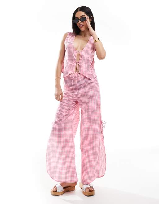 Esmée - Exclusives - Strandbroek met gingham ruit en gestrikte zijkanten in roze