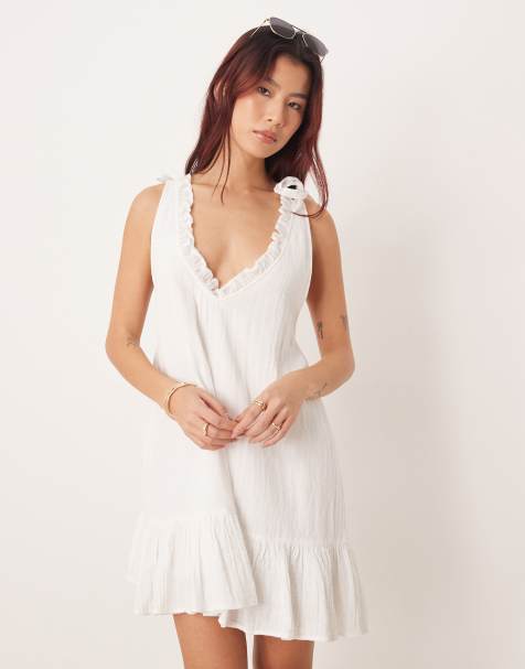 Esmee mini beach dress with ruffle trim neckline in white