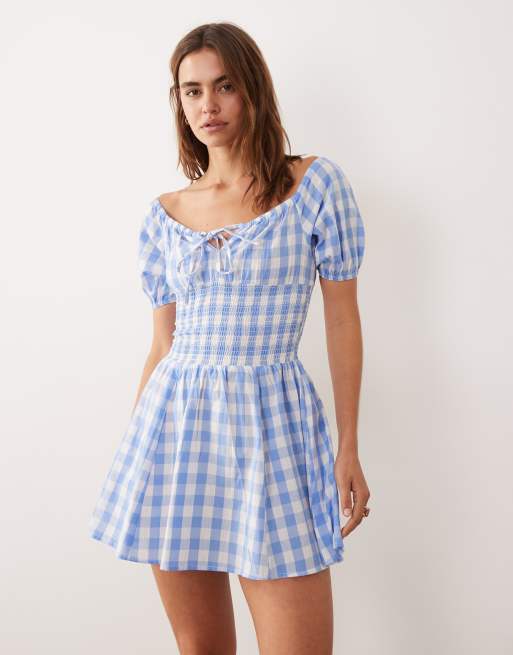 Esmée - Mini-strandkjole med bindebånd foran og pufærmer i blåt og hvidt gingham-print, 2 af 4
