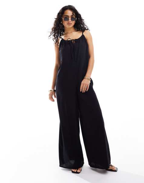 Esmee – Svart, skir strandjumpsuit med knytning framtill, bar rygg och ledig passform - view 1