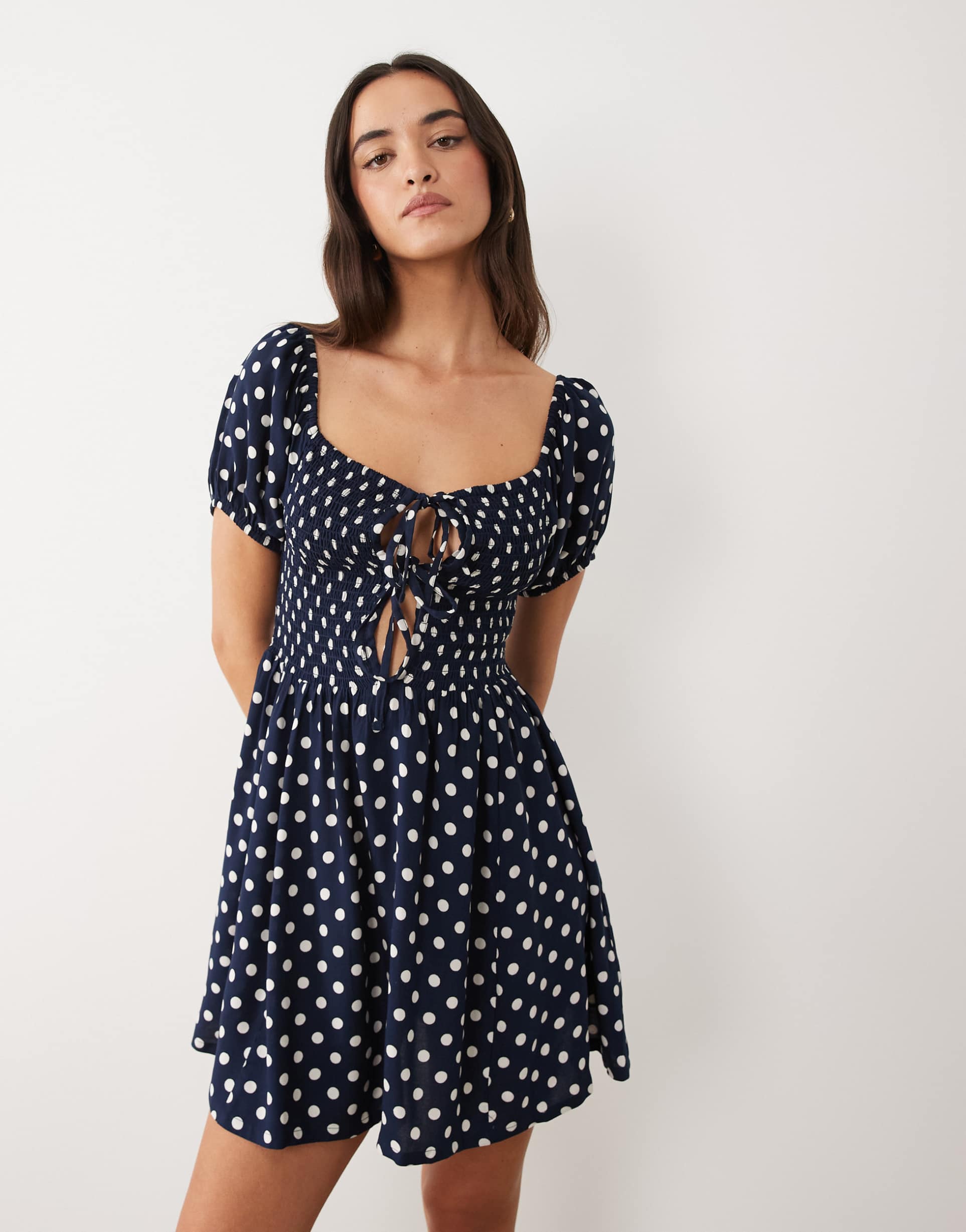 esmee tie front puff sleeve mini beach dress in navy polka dot