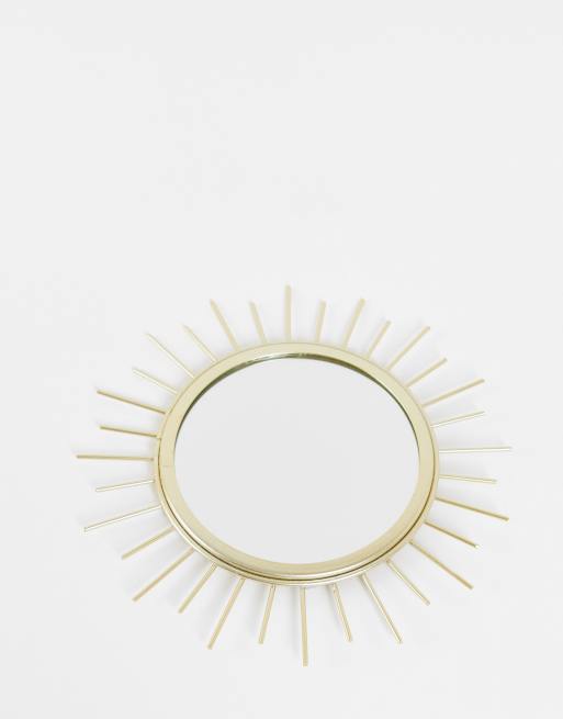 Espejo dorado con diseño solar de Sass & Belle