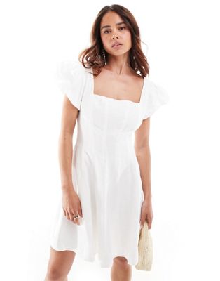 paneled ruffle mini dress in ivory-White