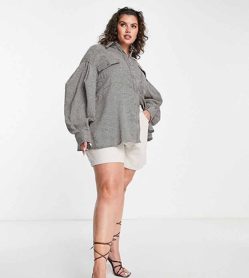 Plus-size shirt by Extro %26 Vert Check you out Spread collar Button placket Button chest pockets Drop shoulders Oversized fit