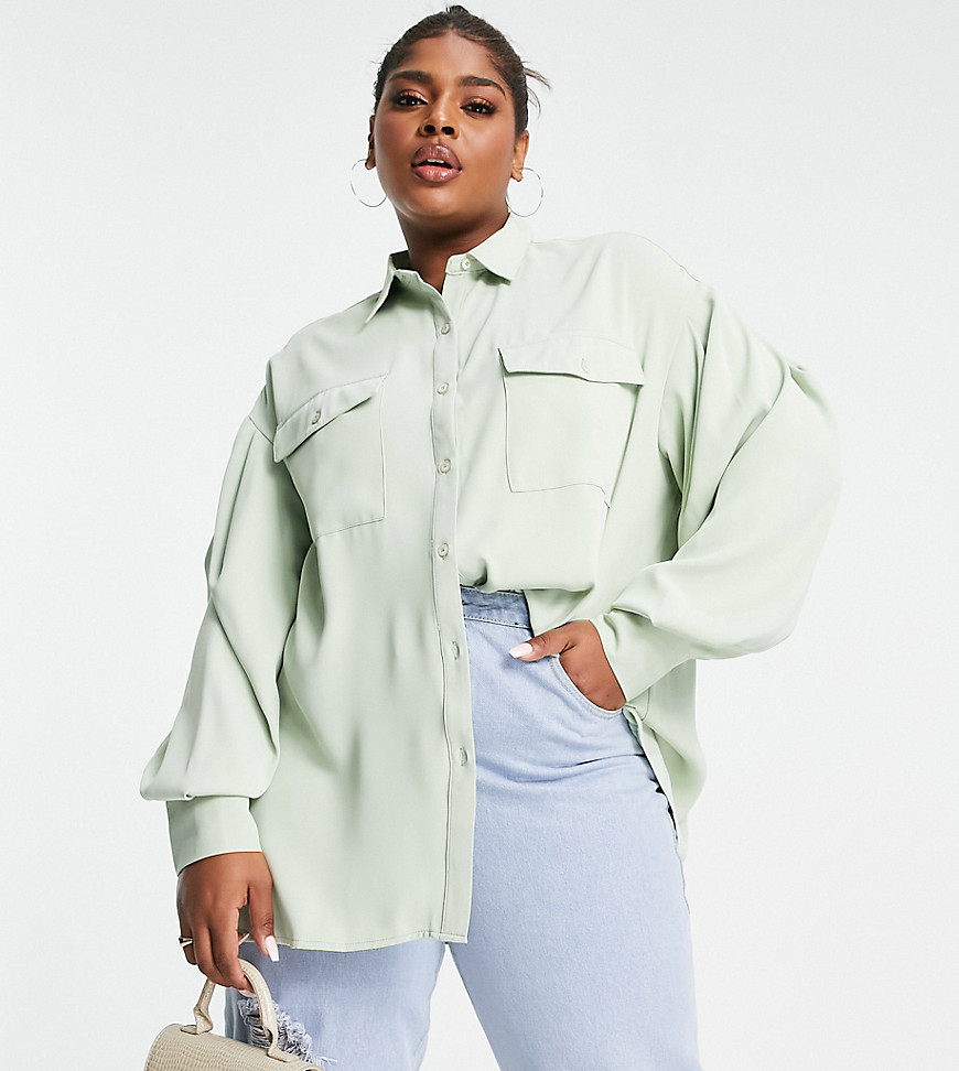 Plus-size shirt by Extro %26 Vert For the rotation Spread collar Button placket Chest pockets Drop shoulders Oversized fit