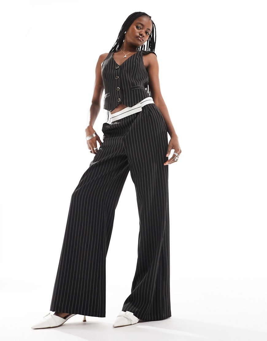 tailored pinstripe pants with asymmetric waistband in black - part of a set