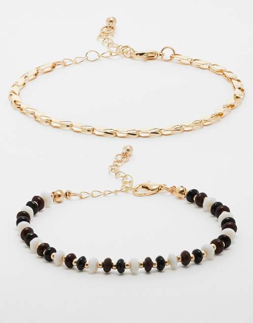 Faded Future - Set van 2 schakelarmbanden met kralen in goud