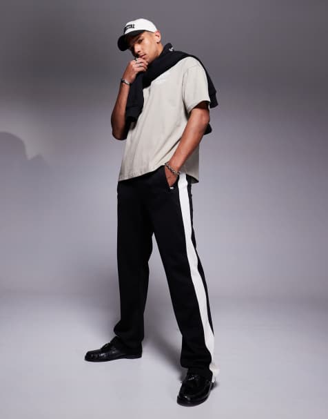 Faded Store wide leg contrast side stripe joggers in black - view 1