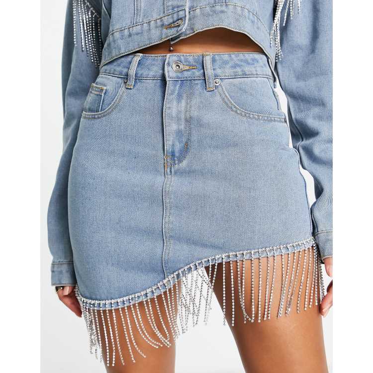 Fae curved hem denim mini skirt with diamante fringe in washed