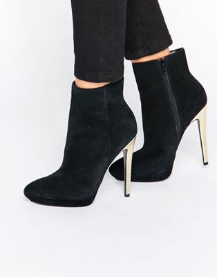 black boots with gold heels
