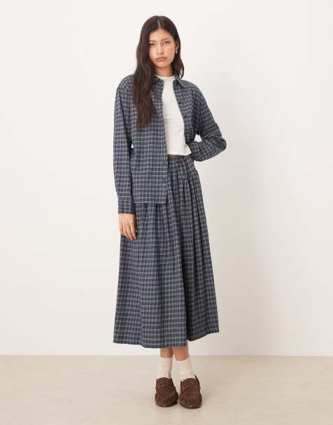 Falda a cuadros pequeños azules y azul cerceta de corte amplio con detalle de lazada en la cintura de AWARE - view 1